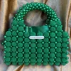 AydaSumayahEmeraldGreenPearlBeadedTopHandleBagwithSatinLining_1 Luxury Emerald Green Pearl Beaded Top Handle Handbag